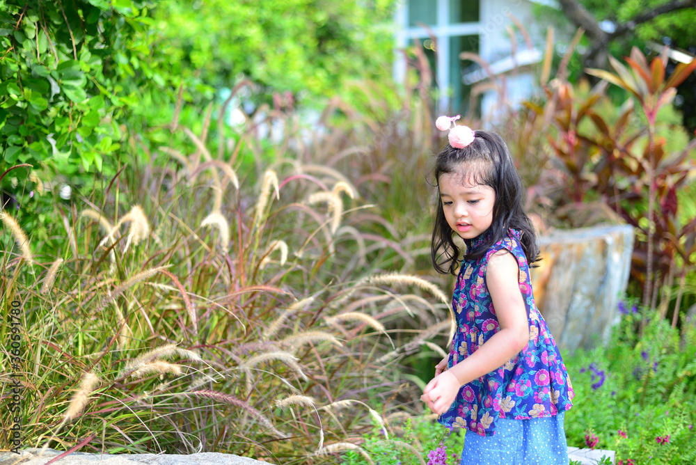 Little Girl and Mother at The Public Park Little Girl and Mother at The Public Park