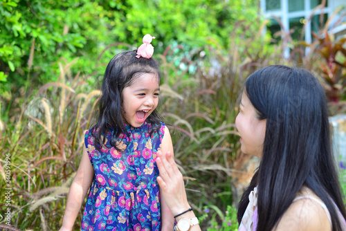 Little Girl and Mother at The Public Park