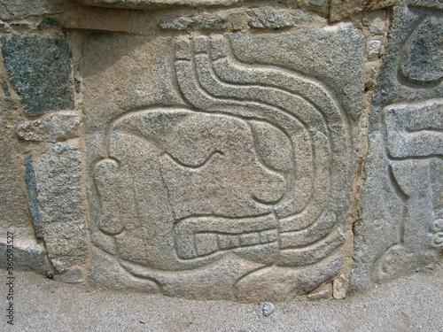 Relief representing severed head blooding at archaeological complex Sechin near Casma (central coast of Peru) photo