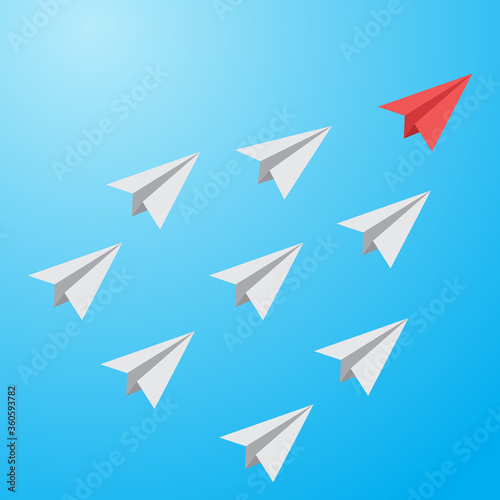 red paper plane lead grey ones on a sky background. Leadership teamwork.