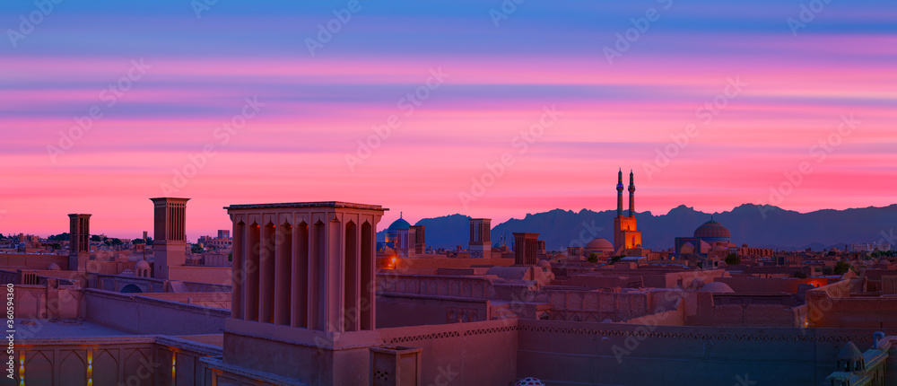 Historic City of Yazd with famous wind towers at red sunset- YAZD, IRAN 