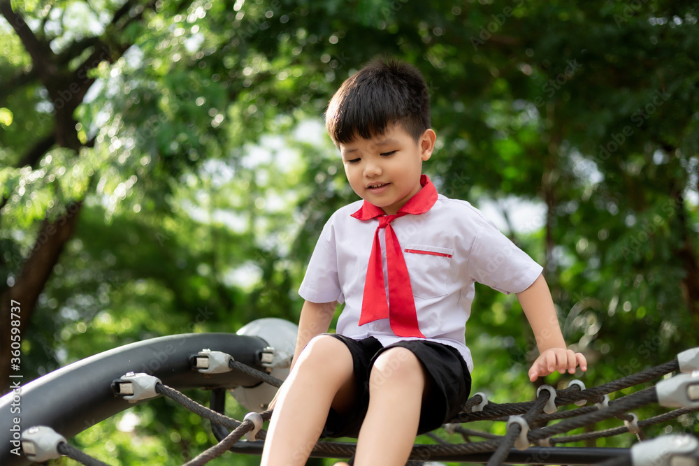Obraz premium Happy cute little child playing in the park outdoors