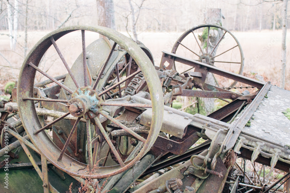 Old and shabby metal agricultural machine, farming machine
