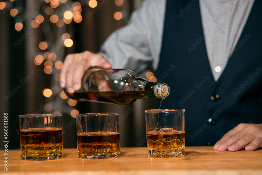 Barman pouring whiskey glass beautiful night Barman pouring whiskey glass beautiful night