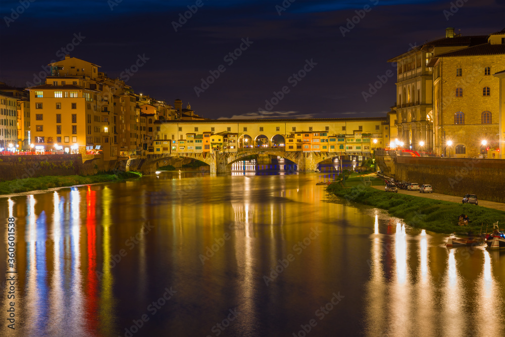 Old Golden Bridge in the night landscape. Florence, Italy
