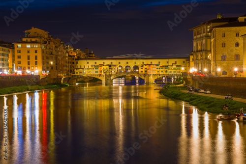 Old Golden Bridge in the night landscape. Florence, Italy