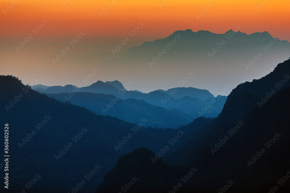 Majestic sunset sky over the mountains landscape