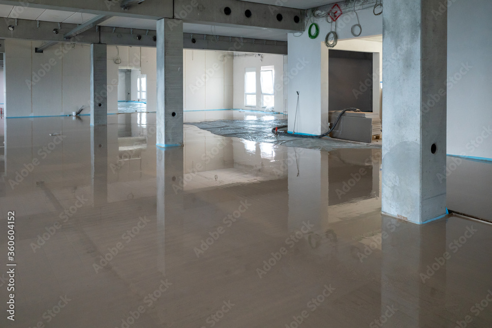on a construction site the liquid screed was poured on the ground