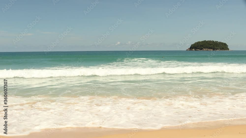 Phuket sea and beach on a clear blue day with strong waves. Phuket sea and beach on a clear blue day with strong waves.