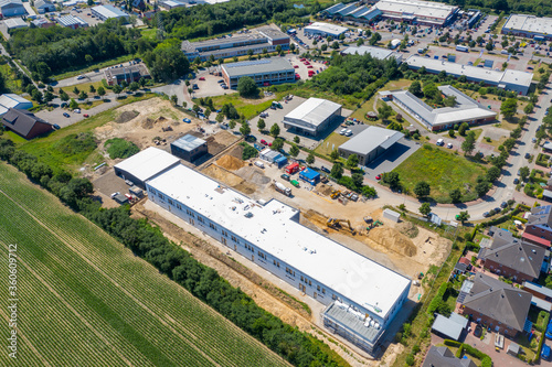  drone photograph of a large construction site where a factory building is being erected © karegg