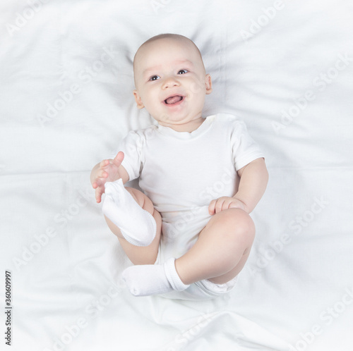 Photo of a six month old baby on a white background photo