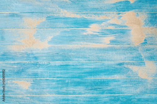 Beach background. Top view of beach sand on wooden planks