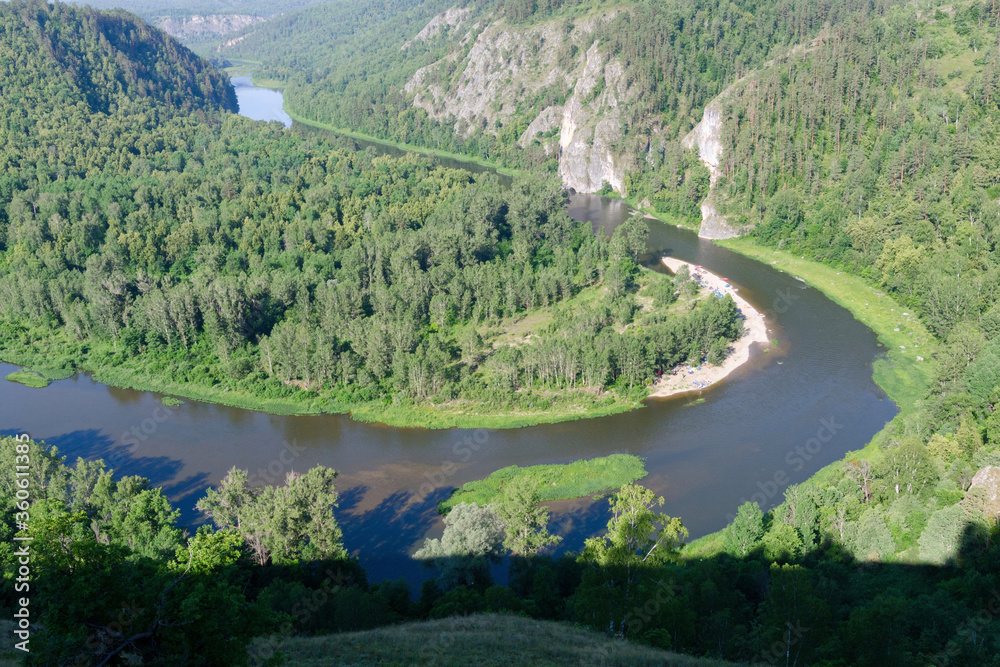 Travel in Russia. View of Belaya river with a tourist camp on its bank. Bashkiria national park, Bashkortostan.