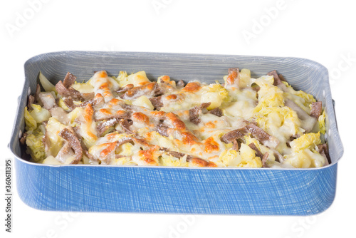 Traditional Italian pasta. Pizzocheri in a baking dish with white background. Pasta from Valtellina photo