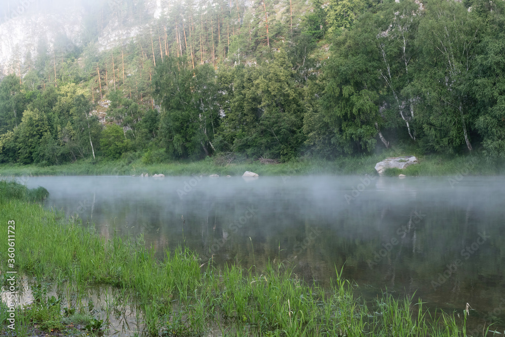Ural landscape. Morning mist on the water of Belaya river. Bashkiria national park, Bashkortostan, Russia. Ural landscape. Morning mist on the water of Belaya river. Bashkiria national park, Bashkortostan, Russia.