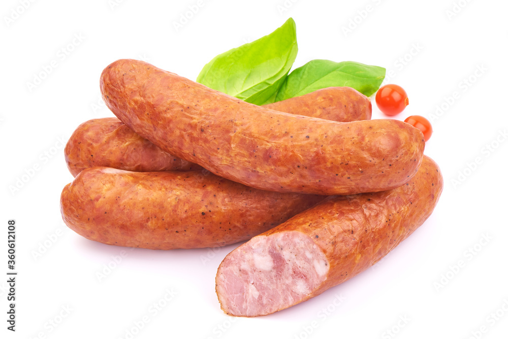 Hungarian Smoked Sausages with basil leaves, isolated on a white background. Close-up. Hungarian Smoked Sausages with basil leaves, isolated on a white background. Close-up.