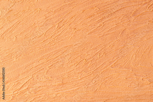 Orange lined plaster texture. Decorative plaster. Wall decor surface background