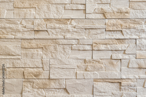 Decorative Stone Wall. Interior Stone Tiles Backdrop. Wall From Light Beige Decorative Stones