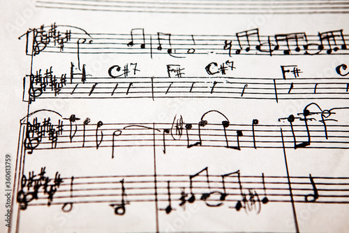 handwritten musical score . Sheet music of musical opus . Sheet music and accords om a paper
