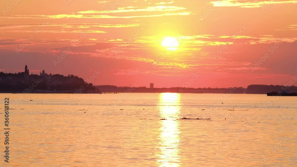 Timelapse of a beautiful sunset over Danube river in Belgrade capital of Serbia with Zemun municipality in the background Timelapse of a beautiful sunset over Danube river in Belgrade capital of Serbia with Zemun municipality in the background
