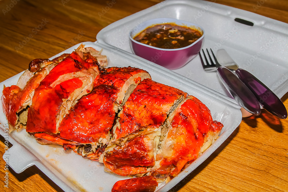 Roasted duck in a foam container Roasted duck in a foam container