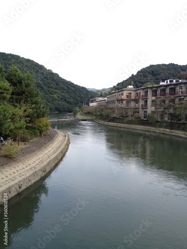 View of Uji city with Uji river, old houses and mountain.