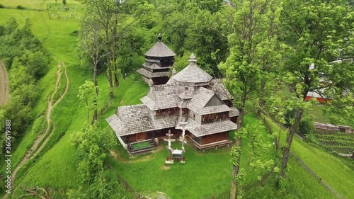 Wooden church in Carpathian, Ukraine. Aerial shot