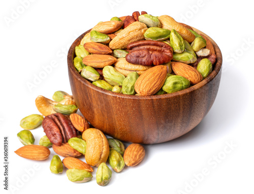 unsalted mixed nuts in the wooden bowl, isolated on white background