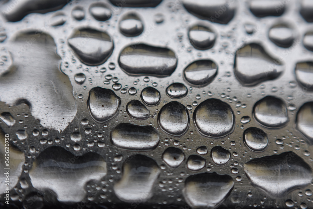 closeup of a beautiful monsoon water drops on a silver floor, Indian Monsoon closeup of a beautiful monsoon water drops on a silver floor, Indian Monsoon
