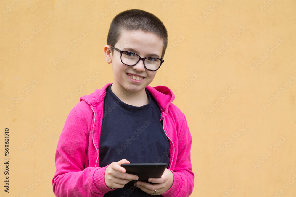 girl with short hair using digital tablet