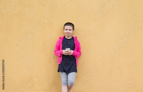 girl with short hair using mobile or cell phone