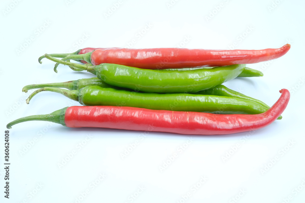 Fresh green and red chili peppers on the white background, organic ingredient for healthy, hot and spicy to help burning fat