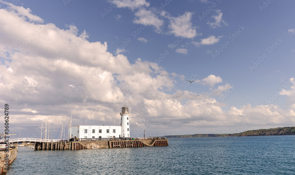 Lighthouse under dramatic clouds.