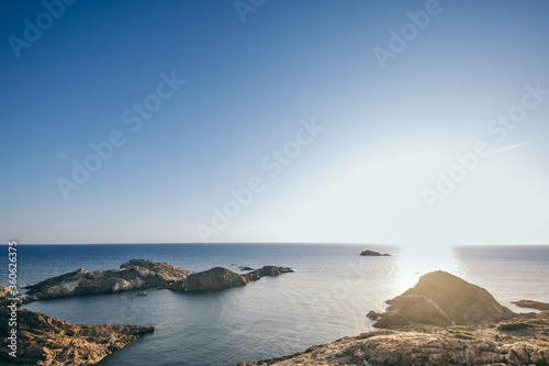 A rocky shore next to a body of water