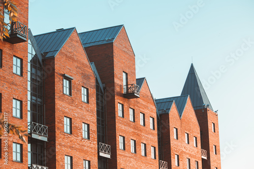 Brick new building with a sharp roof in the city of Dnipro.