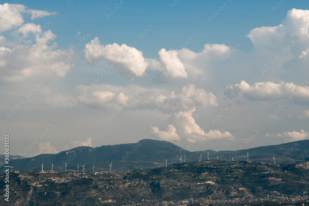 Landscape with hills and wind turbines