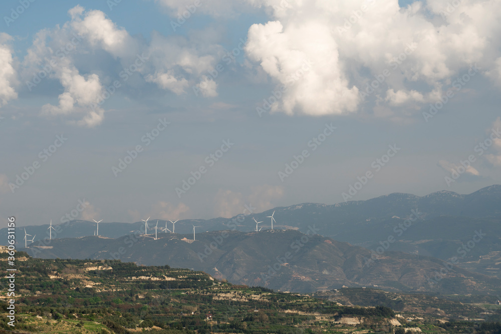 Mountains, sky, and wind turbines