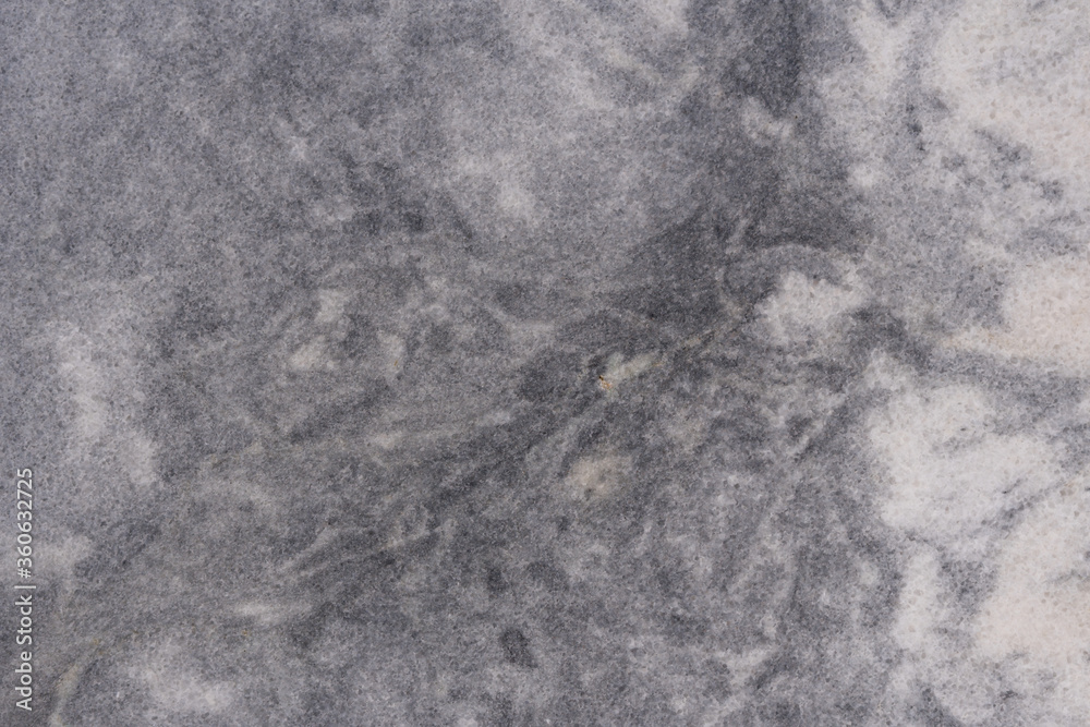 Naklejka premium Close-up - gray stone wall in the old facade of the house