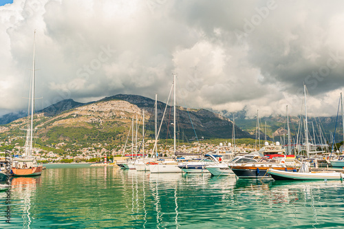 Bar, Montenegro Fishing Boats On The Background Of Mountains And Cloudy Sky On The Adriatic Coast