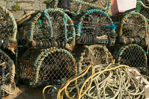 Lobster pots on the quayside New Quay Ceredigion Wales