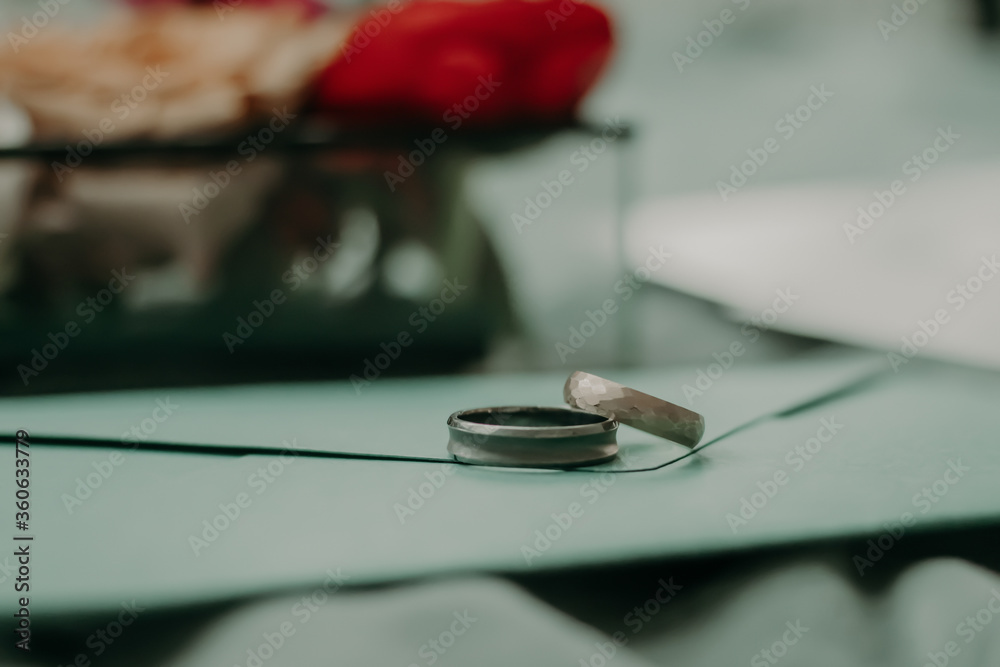 wedding rings lie on an envelope. macro photography wedding rings lie on an envelope. macro photography