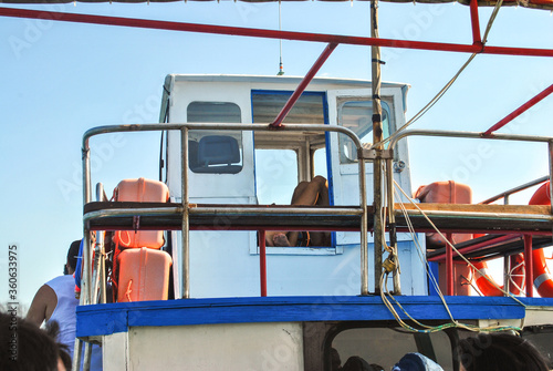 Captains cabin on old fish boat and orange lifebuoy