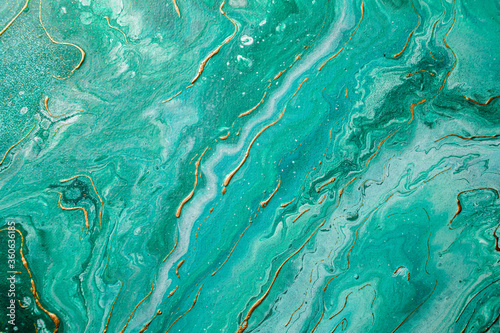 Green and gold marble abstract background. Liquid marble pattern. Fluid art. Colorful.
