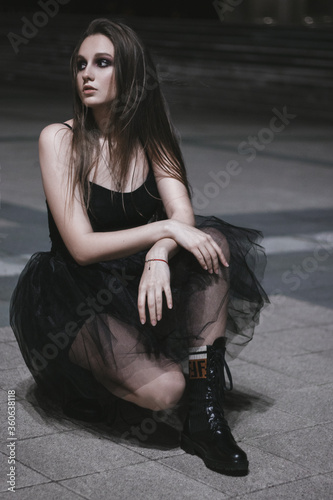young woman in black dress photo