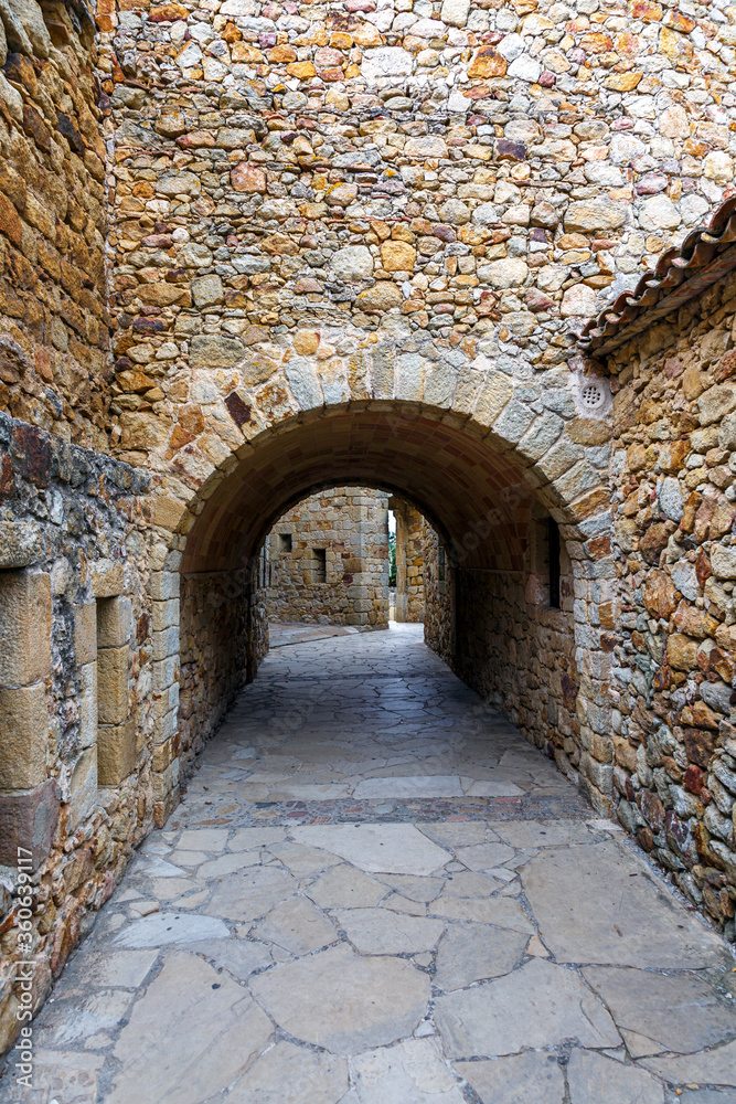 Castle de Pals, historic stone walls and arches, Pals, Spain