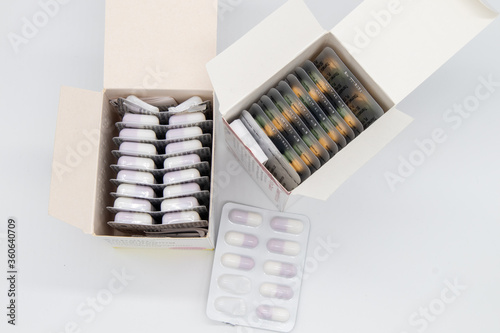 A lot of medical pills in boxes on a white background