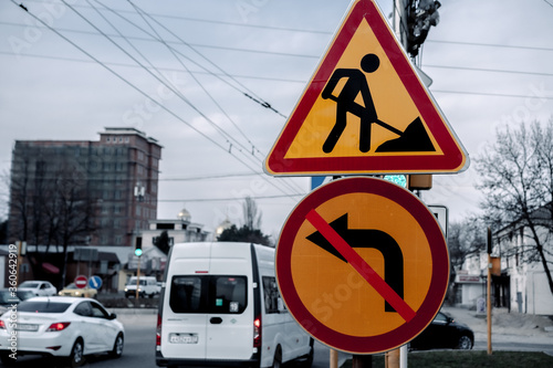 Road repair and turn ban signs