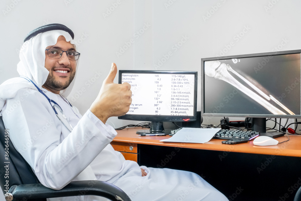 Arabic muslim doctor at his office on his computer Arabic muslim doctor at his office on his computer