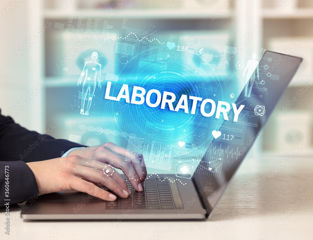 Doctor working a health check with LABORATORY inscription, recording medical test results Doctor working a health check with LABORATORY inscription, recording medical test results