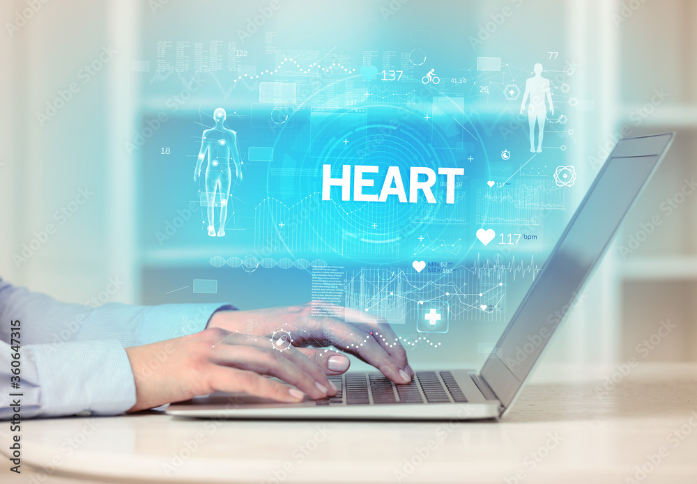 Obraz premium Doctor working a health check with HEART inscription, recording medical test results
